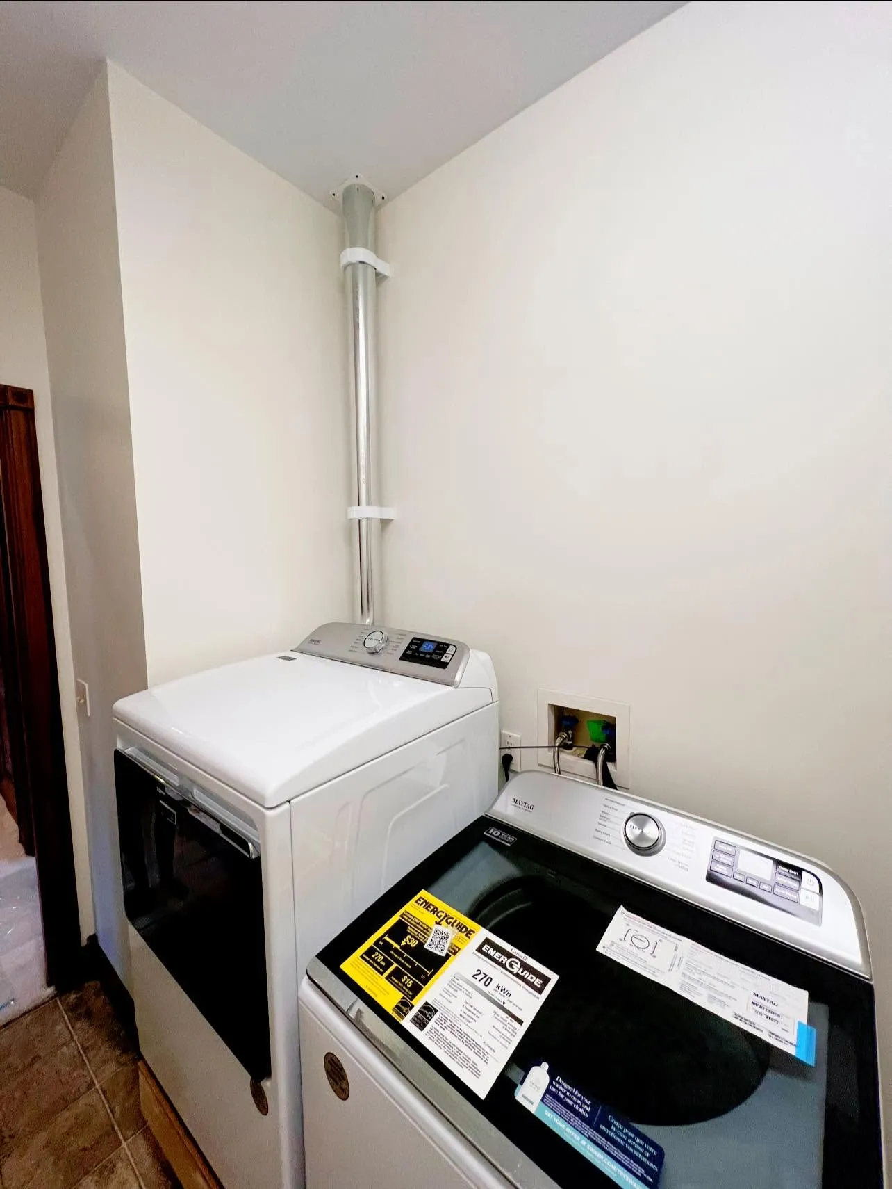 Newly installed rigid metal dryer vent run in a Dayton laundry room